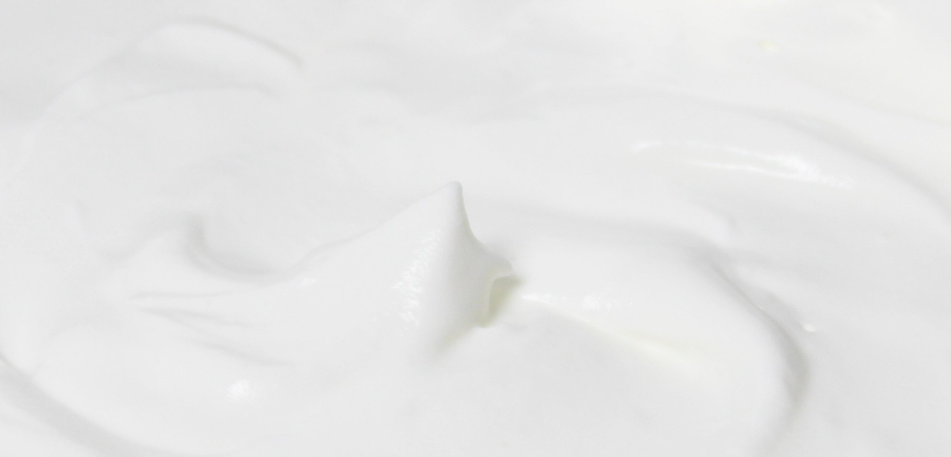 Artistic image of a chef pouring cream.